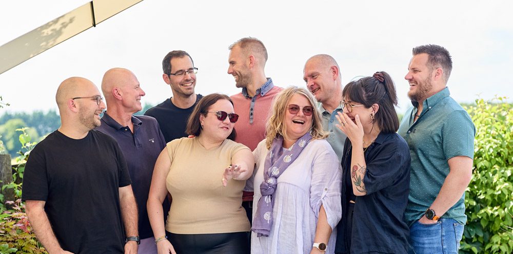 Who We Are a few members of the team standing together. cyan solutions, Purpose-Driven IT Business, IT support