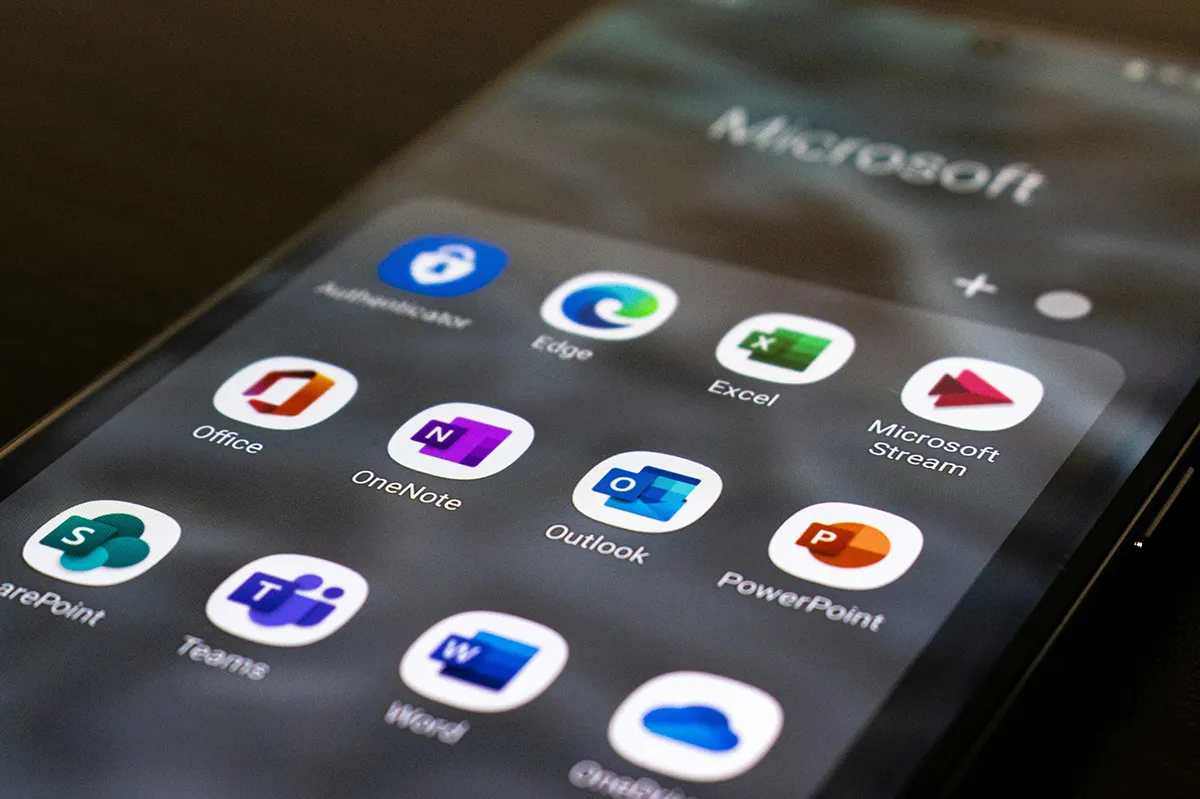 Free Microsoft Nonprofit Licenses to End in 2025 Microsoft nonprofit licenses to end. a phone screen with microsoft 365 apps on display