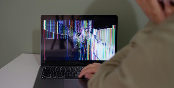 5 Signs You Need A New IT Provider a broken laptop with a frustrated user