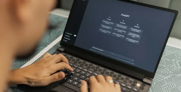 ai for business. a person on a laptop with chatgpt on the screen