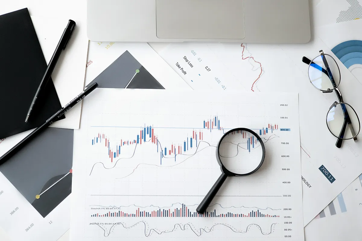 ai risks. a table with printed graphs and charts